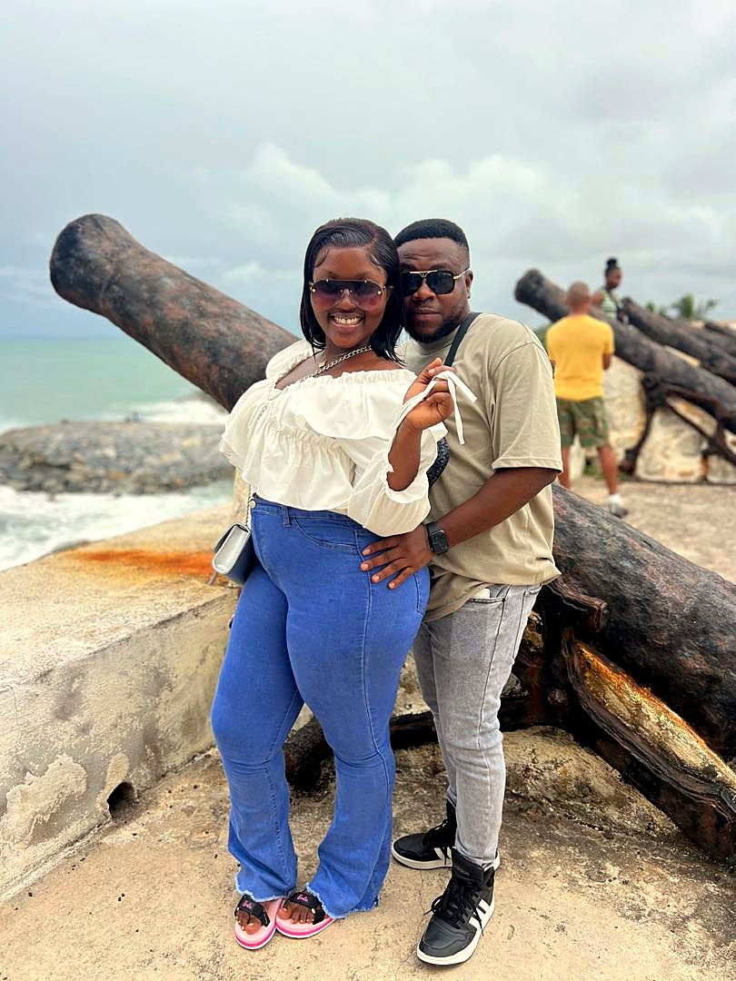 Eddy and Kessewa laughing together by the sea